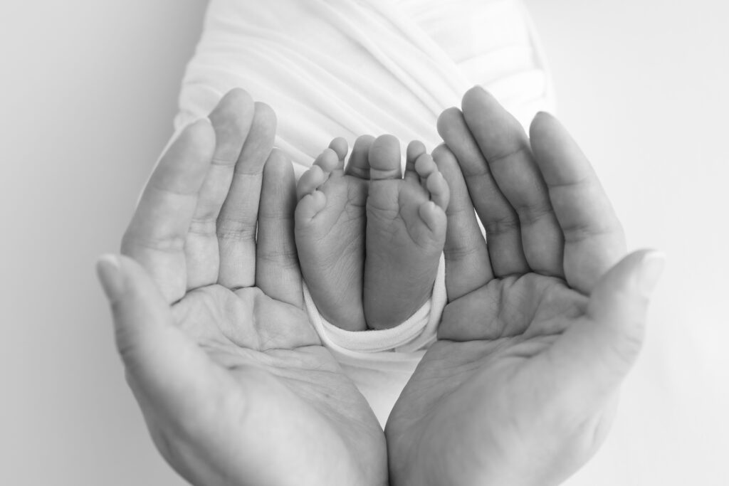 picture of open hands and tiny feet
